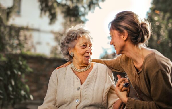 pexels-andrea-piacquadio-3768131 A younger woman engages in conversation with an older woman about matters concerning end-of-life care.